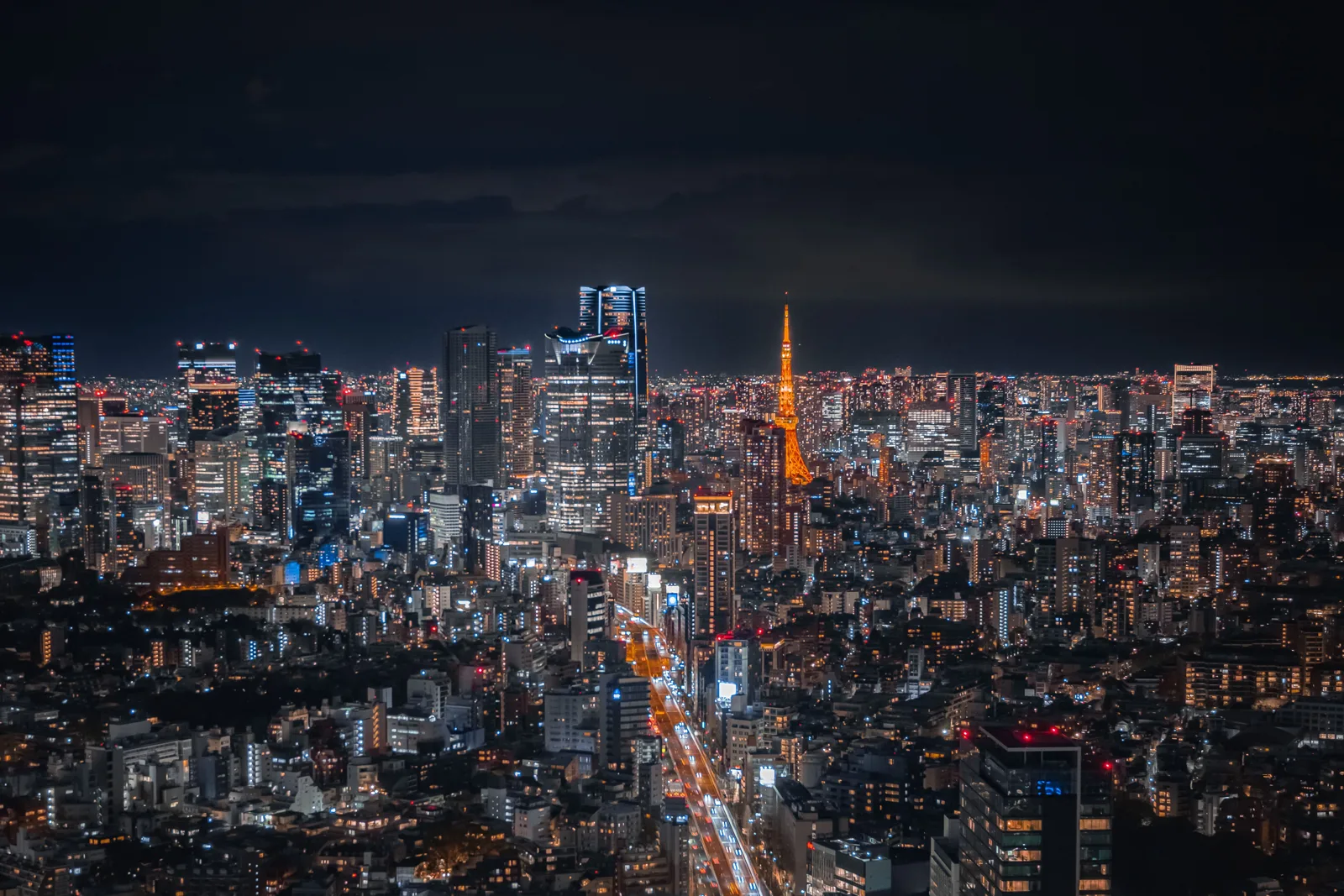 City skyline under a dark, dramatic sky